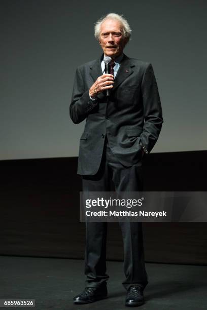 Clint Eastwood speaks on stage during the 'Unforgiven' restored copy presentation during the 70th annual Cannes Film Festival at Salle Debussy on May...