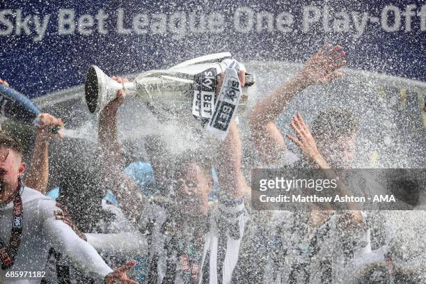 Tony Craig of Millwall holds up the trophy during the Sky Bet League One Playoff Final between Bradford City and Millwall at Wembley Stadium on May...