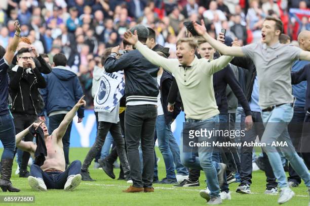 Millwall fans invade the pitch on the final whistle during the Sky Bet League One Playoff Final between Bradford City and Millwall at Wembley Stadium...