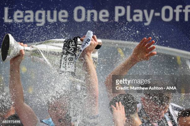 Tony Craig of Millwall holds up the trophy during the Sky Bet League One Playoff Final between Bradford City and Millwall at Wembley Stadium on May...