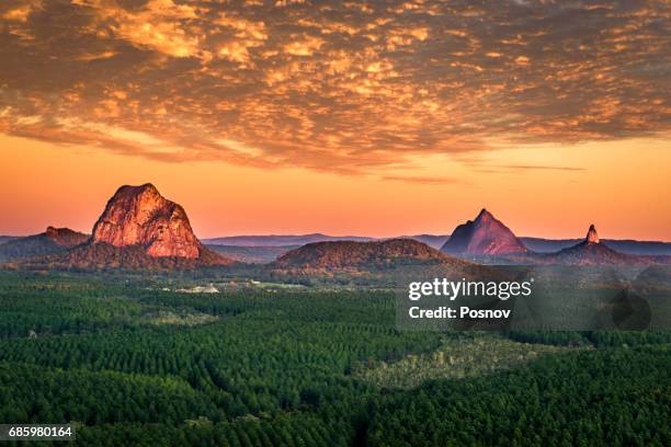 sunrise over glass house mountains of queensland - rural queensland stock pictures, royalty-free photos & images