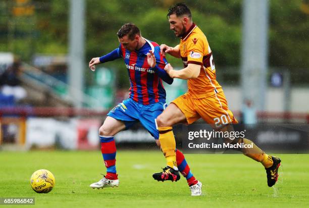 Billy McKay of Inverness Caledonian Thistle vies with Craig Clay of Motherwell during the Ladbrokes Premiership match between Inverness Caledonian...