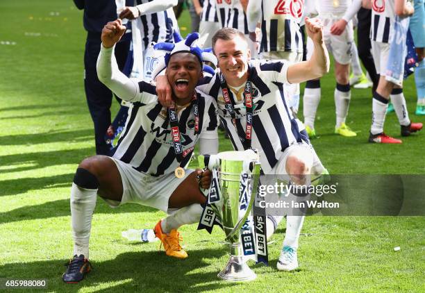 Mahlon Romeo and Jed Wallace of Millwall celebrate victory and promotion with the trophy after the Sky Bet League One Playoff Final between Bradford...