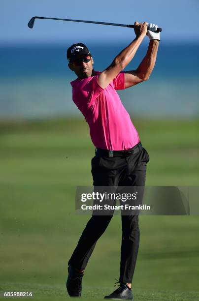 Alvaro Quiros of Spain plays a shot on the 16th hole during the third round of The Rocco Forte Open at The Verdura Golf and Spa Resort on May 20,...