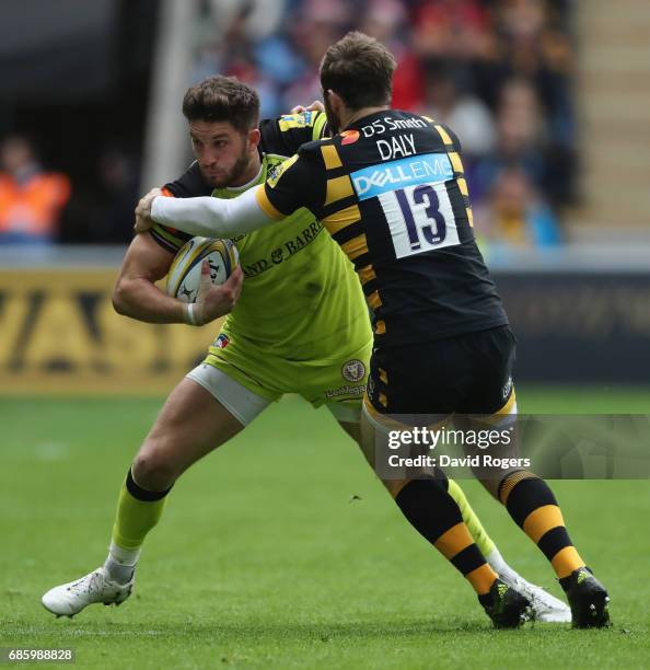 Owen Williams of Leicester is tackled by Elliot Daly during the Aviva Premiership semi final match between Wasps and Leicester Tigers at The Ricoh...