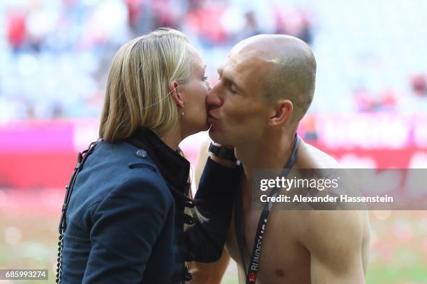 Arjen Robben of Bayern Muenchen celebrates with his wife Bernadien Robben following the Bundesliga match between Bayern Muenchen and SC Freiburg at...