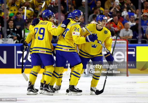 Team members of Sweden celebrate their opening goal during the 2017 IIHF Ice Hockey World Championship semi final game between Sweden and Finland at...