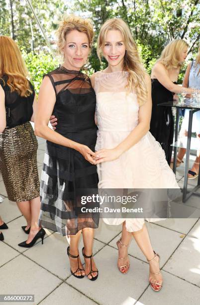 Sanny Van Heteren and Julia Dietze attend the unveiling of the Isabell Kristensen Couture 2017 Cannes Red Carpet Collection at the JW Marriott on May...