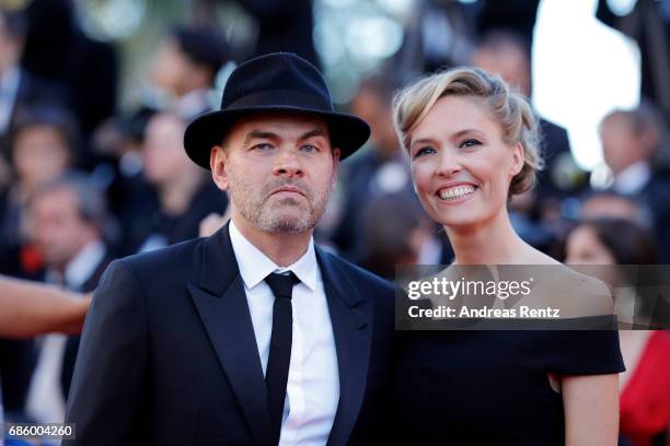 Clovis Cornillac and wife Lilou Fogli attend the "120 Beats Per Minute " premiere during the 70th annual Cannes Film Festival at Palais des Festivals...