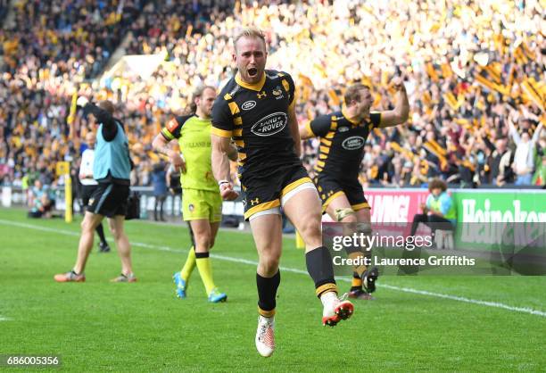Dan Robson of Wasps jumps for joy on the fianl whistle after victory in the Aviva Premiership match between Wasps and Leicester Tigers at The Ricoh...