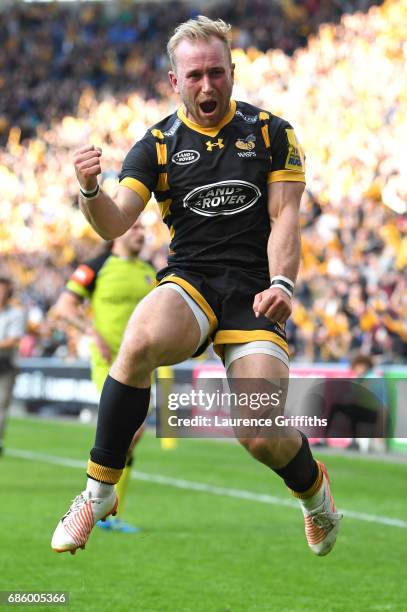 Dan Robson of Wasps jumps for joy on the fianl whistle after victory in the Aviva Premiership match between Wasps and Leicester Tigers at The Ricoh...