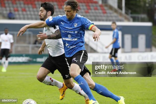 Fredrik Liverstam of Halmstad BK and Nahir Besara of Orebro SK competes for the ball during the Allsvenskan match between Halmstad BK and Orebro SK...