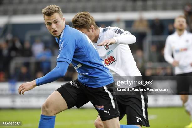 Gabriel Gudmundsson of Halmstad BK and Martin Lorentzson of Orebro SK competes for the ball during the Allsvenskan match between Halmstad BK and...