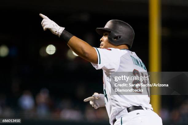 Yasmany Tomas of the Arizona Diamondbacks points to the crowd after hitting a home run at Chase Field on May 16, 2017 in Phoenix, Arizona.