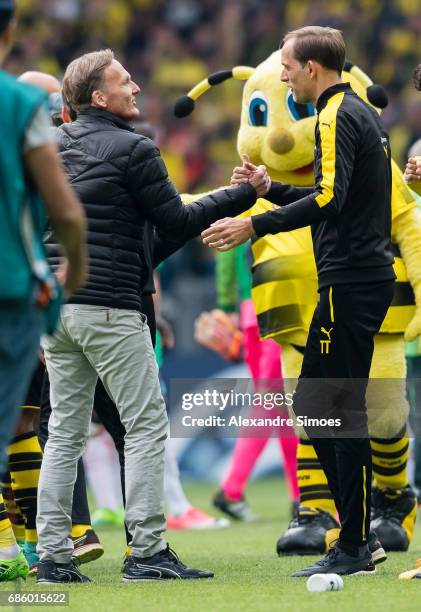 Hans-Joachim Watzke, CEO of Borussia Dortmund, celebrates the win together with head coach Thomas Tuchel after the final whistle during the...