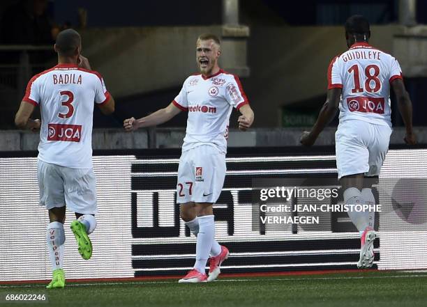 Nancy's French defender Tobias Badila congratulates midfielder Alexis Busin after he scored a goal during the French L1 football match between Nancy...