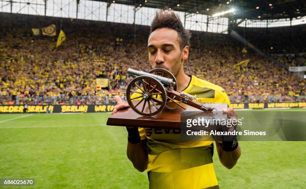 Pierre-Emerick Aubameyang of Borussia Dortmund celebrates getting the trophy for being the top scorer of this season after the final whistle during...