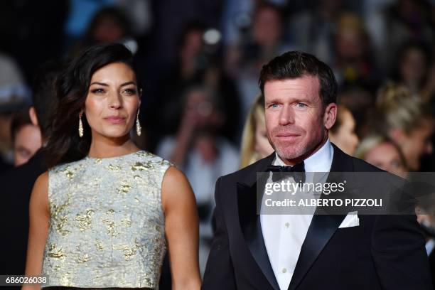 Director Taylor Sheridan and his wife Nicole Sheridan arrive on May 20, 2017 for the screening of the film 'Wind River' at the 70th edition of the...