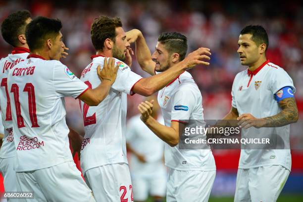 Sevilla's Italian forward Franco Vazquez celebrates after scoring a goal with Sevilla's Argentinian midfielder Joaquin Correa , Sevilla's Montenegrin...
