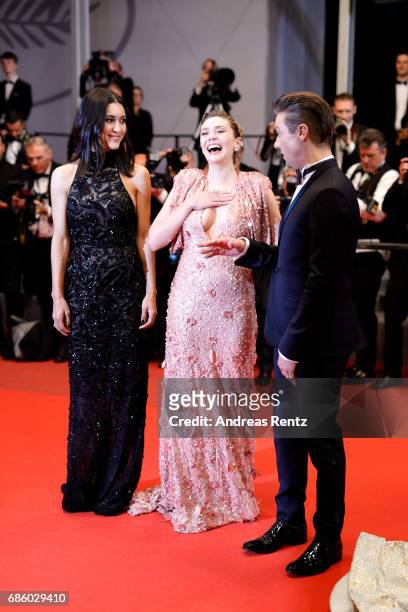 Actors Julia Jones, Elizabeth Olsen and Jeremy Renner of "Wind River" attend "The Square" premiere during the 70th annual Cannes Film Festival at...