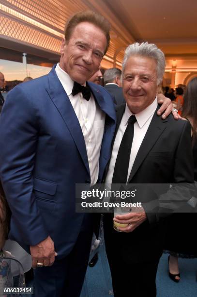 Arnold Schwarzenegger and Dustin Hoffman attend the Vanity Fair and HBO Dinner celebrating the Cannes Film Festival at Hotel du Cap-Eden-Roc on May...