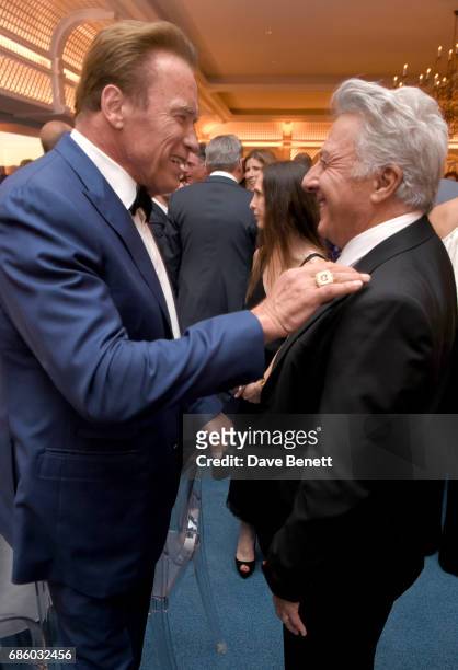 Arnold Schwarzenegger and Dustin Hoffman attend the Vanity Fair and HBO Dinner celebrating the Cannes Film Festival at Hotel du Cap-Eden-Roc on May...