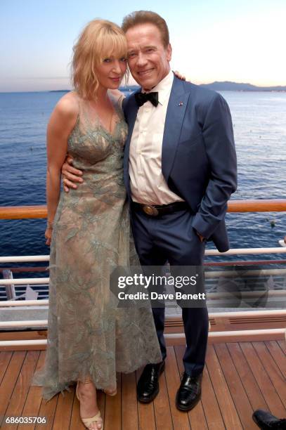 Uma Thurman and Arnold Schwarzenegger attend the Vanity Fair and HBO Dinner celebrating the Cannes Film Festival at Hotel du Cap-Eden-Roc on May 20,...