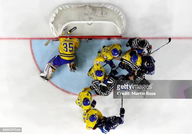 The referees try to break up a fight betwenn players of Sweden and of Finland during the 2017 IIHF Ice Hockey World Championship semi final game...