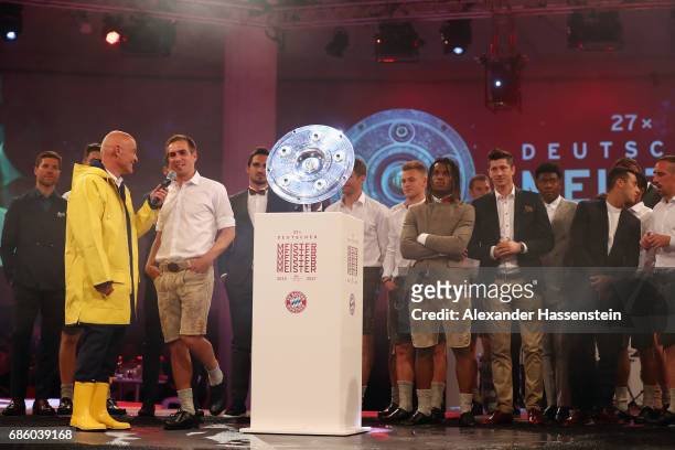 Stephan Lehmann talks to Philipp Lahm during the FC Bayern Muenchen Championship party following the Bundesliga match between Bayern Muenchen and SC...