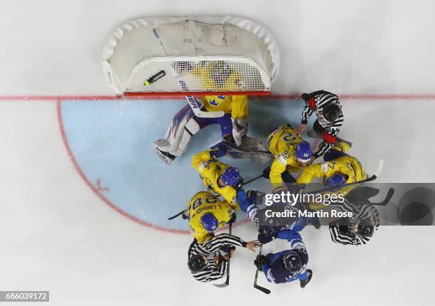 The referees try to break up a fight betwenn players of Sweden and of Finland during the 2017 IIHF Ice Hockey World Championship semi final game...