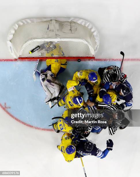 The referees try to break up a fight betwenn players of Sweden and of Finland during the 2017 IIHF Ice Hockey World Championship semi final game...