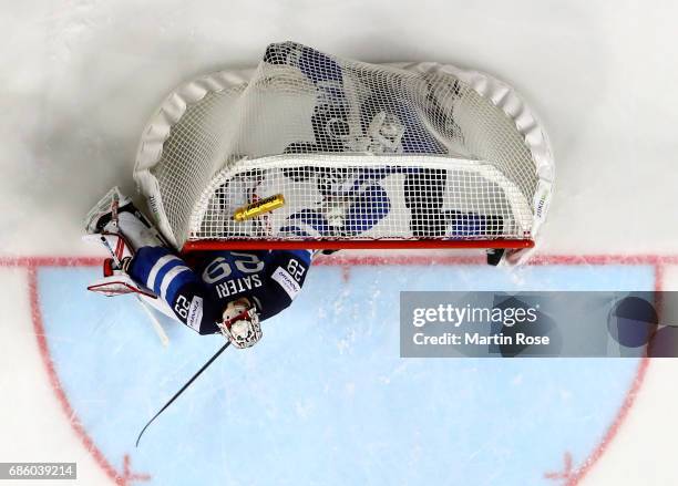 Julius Honka of Finland slides into the net during the 2017 IIHF Ice Hockey World Championship semi final game between Sweden and Finland at Lanxess...