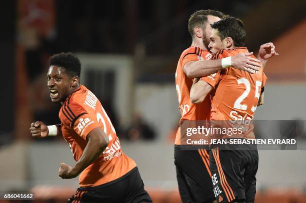 Lorient's French defender Vincent Le Goff celebrates with teammates after scoring a goal during the French L1 football match between Lorient and...