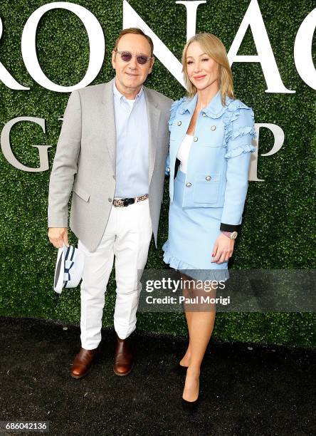 Actor Kevin Spacey and Chairman and President of The Stronach Group Belinda Stronach arrive at The Stronach Group Owner's Chalet at 142nd Preakness...