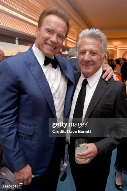 Arnold Schwarzenegger and Dustin Hoffman attend the Vanity Fair and HBO Dinner celebrating the Cannes Film Festival at Hotel du Cap-Eden-Roc on May...