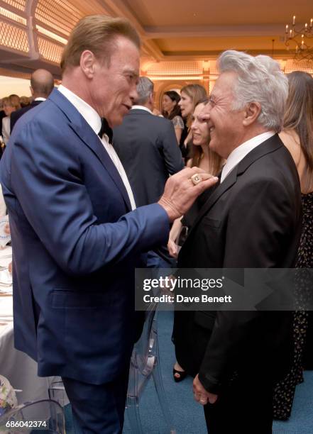 Arnold Schwarzenegger and Dustin Hoffman attend the Vanity Fair and HBO Dinner celebrating the Cannes Film Festival at Hotel du Cap-Eden-Roc on May...