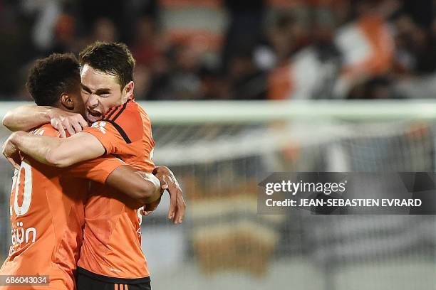 Lorient's French defender Vincent Le Goff celebrates with a teammate after scoring a goal during the French L1 football match between Lorient and...