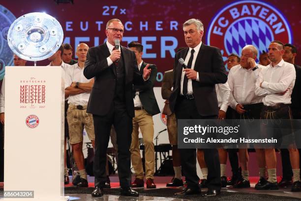 Karl-Heinz Rummenigge talks to head coach Carlo Ancelotti during the Bayern Muenchen Championship party following the Bundesliga match between Bayern...