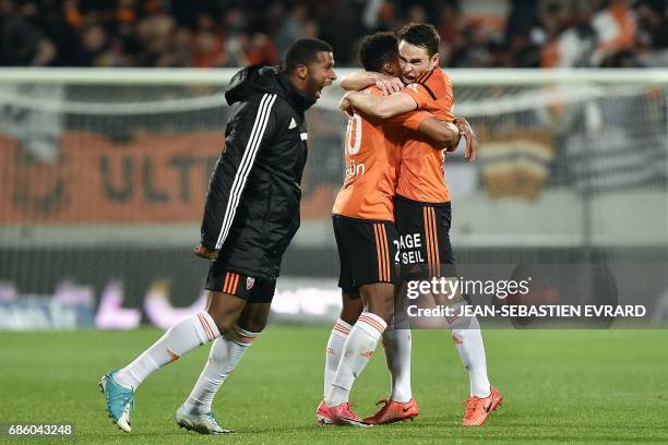 Lorient's French defender Vincent Le Goff celebrates with a teammate after scoring a goal during the French L1 football match between Lorient and...