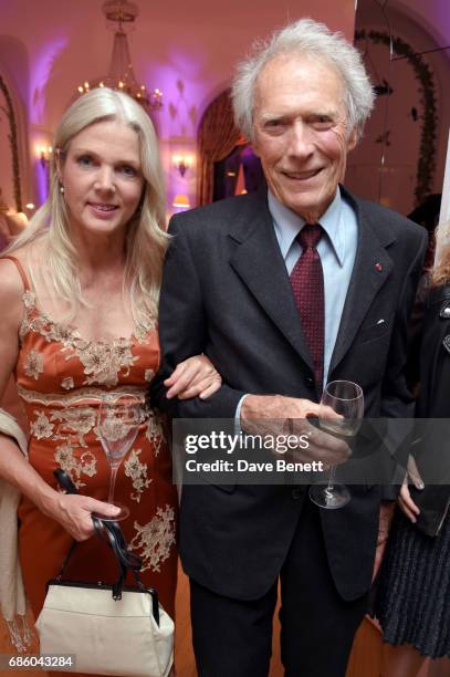 Christina Sandera and Clint Eastwood attend the Vanity Fair and HBO Dinner celebrating the Cannes Film Festival at Hotel du Cap-Eden-Roc on May 20,...