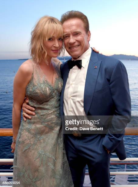 Uma Thurman and Arnold Schwarzenegger attend the Vanity Fair and HBO Dinner celebrating the Cannes Film Festival at Hotel du Cap-Eden-Roc on May 20,...