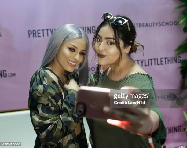 Fashion Influencer Isabel Bedoya takes a selfie with a guest during Beautycon Festival NYC 2017 at Brooklyn Cruise Terminal on May 20, 2017 in New...