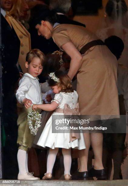 Prince George of Cambridge and Princess Charlotte of Cambridge accompanied by their nanny Maria Teresa Borrallo attend the wedding of Pippa Middleton...