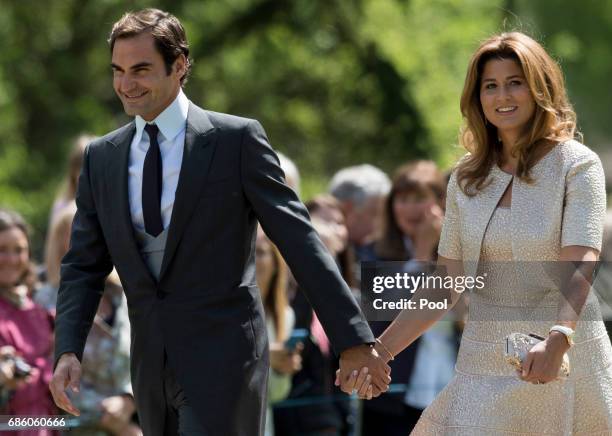 Roger Federer and Mirka Federer attend the wedding of Pippa Middleton and James Matthews at St Mark's Church on May 20, 2017 in Englefield Green,...