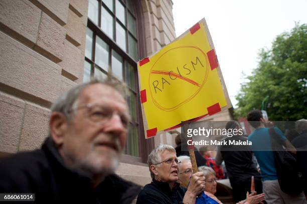Demonstrators attend a counter protest rally, organized by the NAACP, in response of a planned Klu Klux Klan rally to be held nearby May 20, 2017 in...