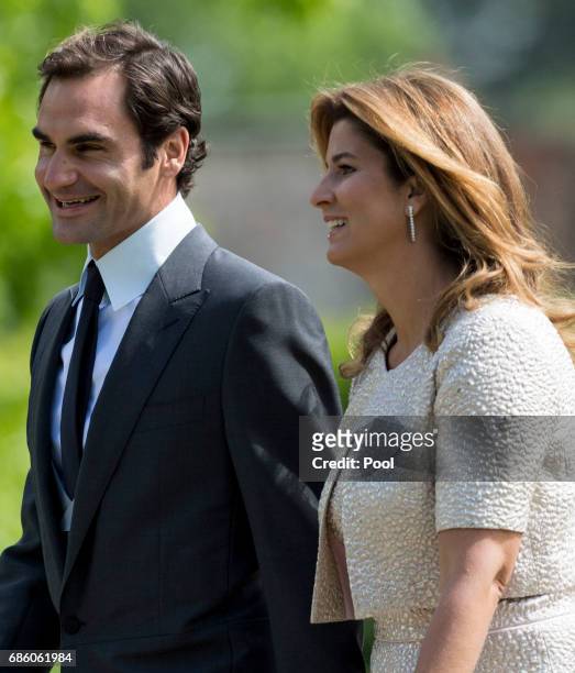 Roger Federer and Mirka Federer attend the wedding of Pippa Middleton and James Matthews at St Mark's Church on May 20, 2017 in Englefield Green,...