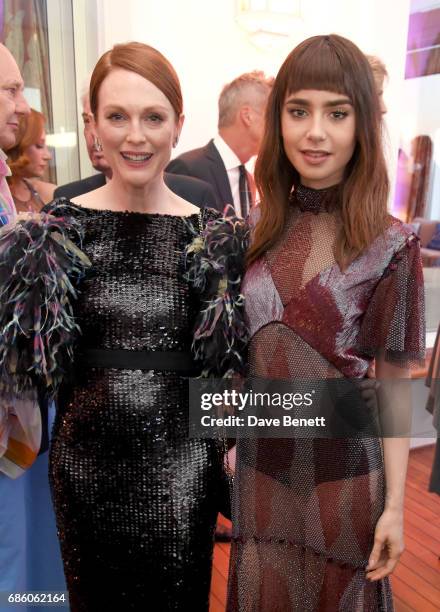 Julianne Moore and Lily Collins attend the Vanity Fair and HBO Dinner celebrating the Cannes Film Festival at Hotel du Cap-Eden-Roc on May 20, 2017...