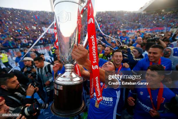 Felipe Mora of Universidad de Chile lifts the championship cup after winning a match between Universidad de Chile v San Luis de Quillota as part of...