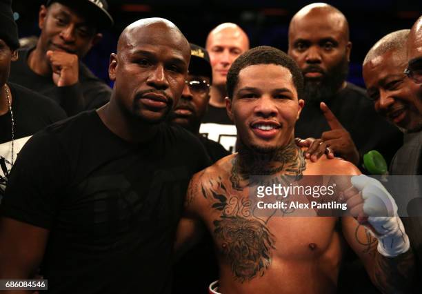 Gervonta Davis of The United States celebrates with Floyd Mayweather following victory against Liam Walsh of England in the IBF World Junior...