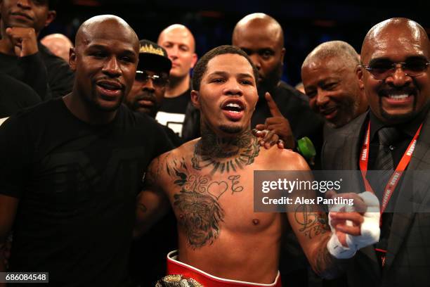 Gervonta Davis of The United States celebrates with Floyd Mayweather following victory against Liam Walsh of England in the IBF World Junior...